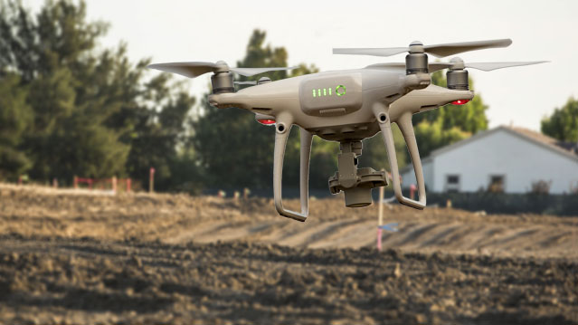 Measuring Earthwork Progress from Drone Topos